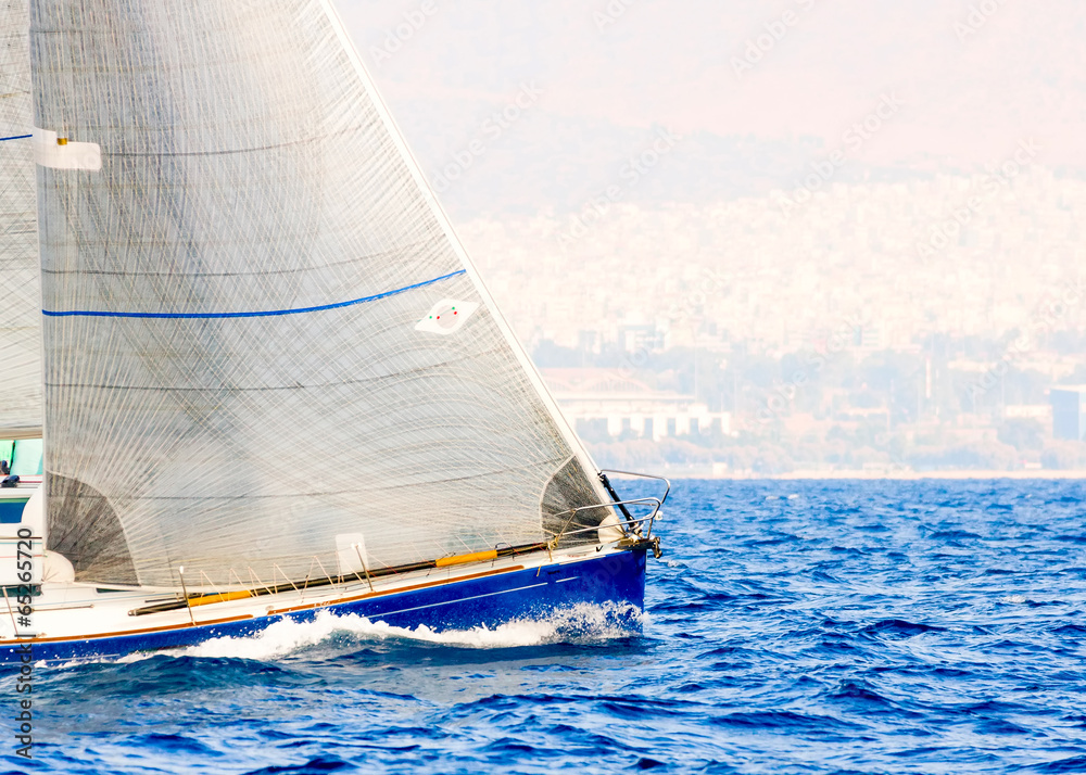 Sailing boat during a regatta out of Poros island in Greece Sailing boat during a regatta out of Poros island in Greece