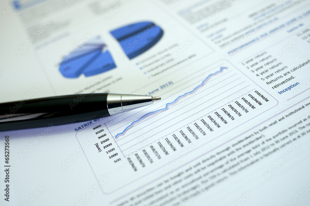pen and financial graph pen and financial graph