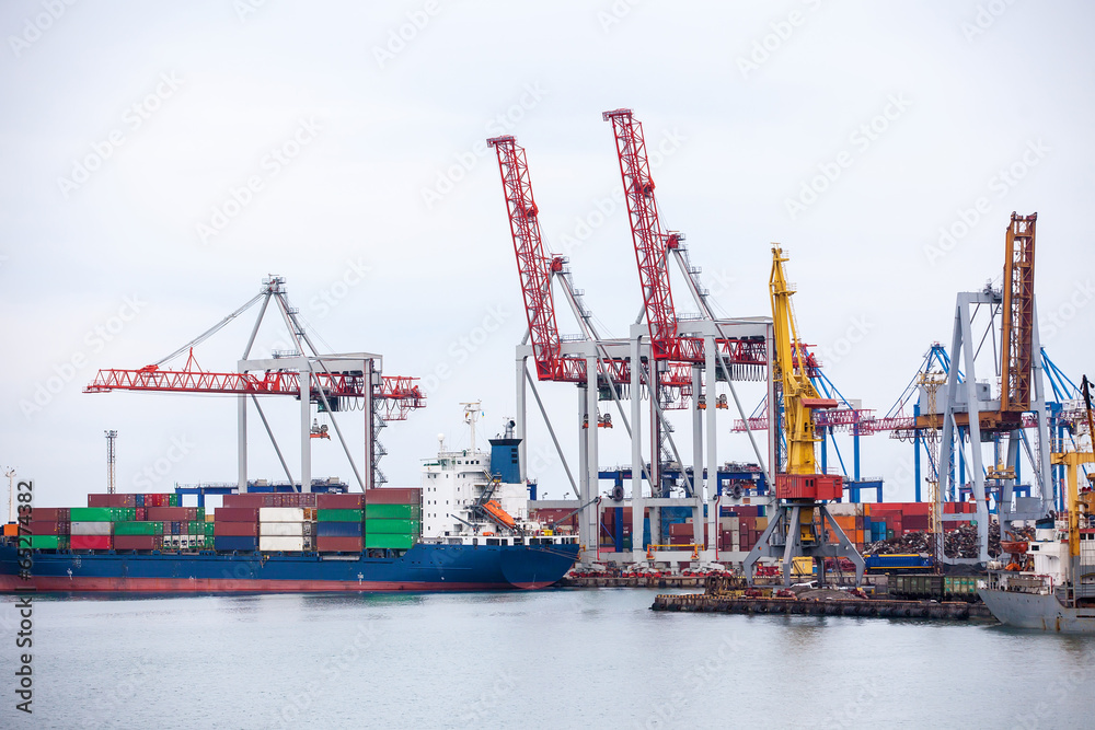 Ship in the dock with elevating cranes