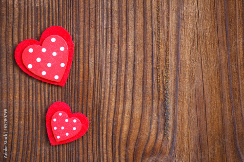 red hearts on wooden board