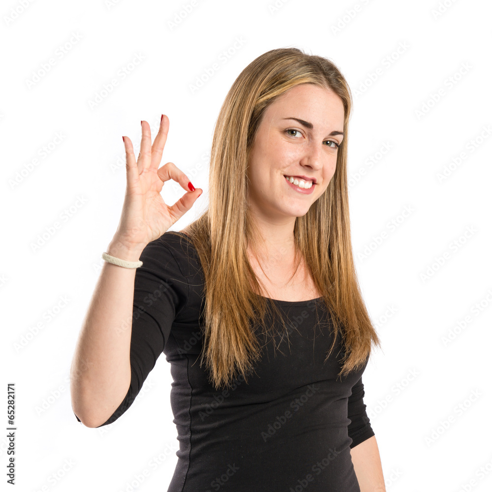 Young woman making Ok sign over white background Young woman making Ok sign over white background