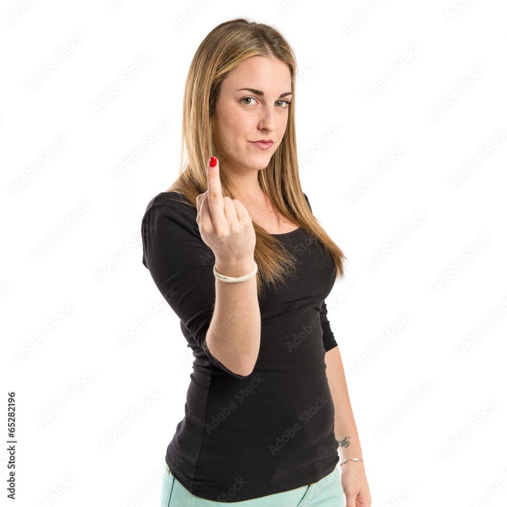 serious girl making horn gesture over white background serious girl making horn gesture over white background