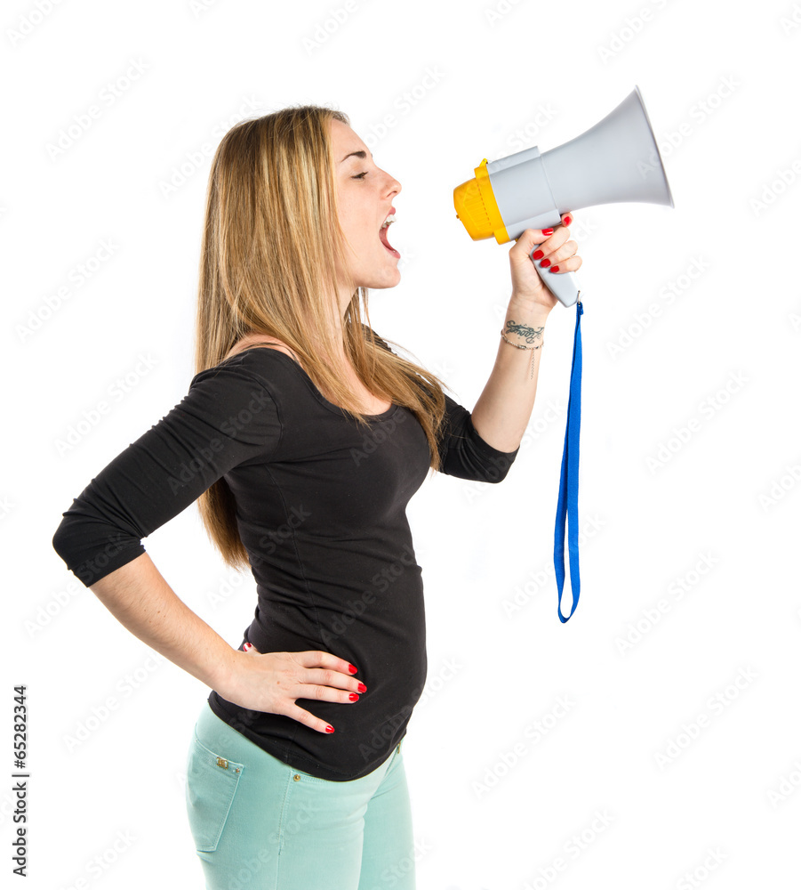 Pretty girl shouting with a megaphone over white background Pretty girl shouting with a megaphone over white background