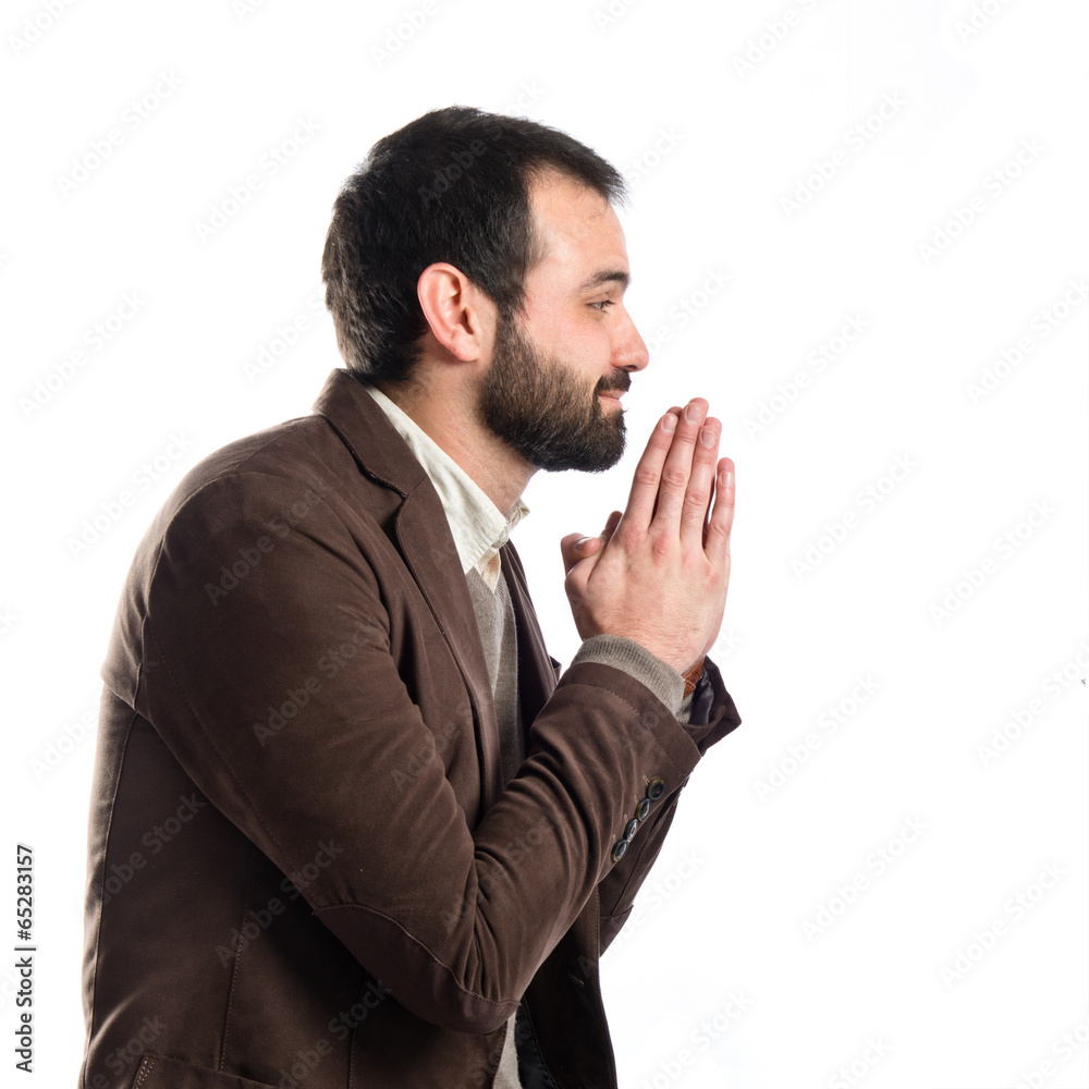 Handsome man pleading over isolated white background Handsome man pleading over isolated white background