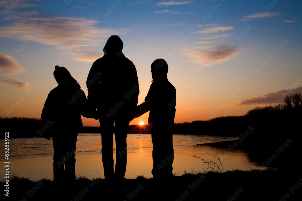 mother and daughters over Danube in Slovakia  - silhouette