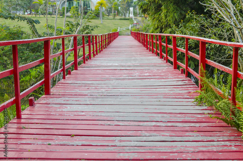 A red wooden bridge long and beautiful. photo