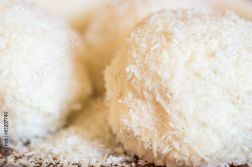 White coconut balls with coconut pieces