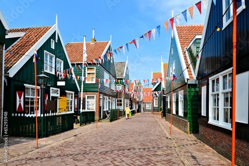 Flag filled street in the village of Marken, Netherlands photo