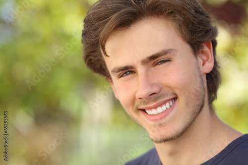 Handsome man face with a white perfect smile