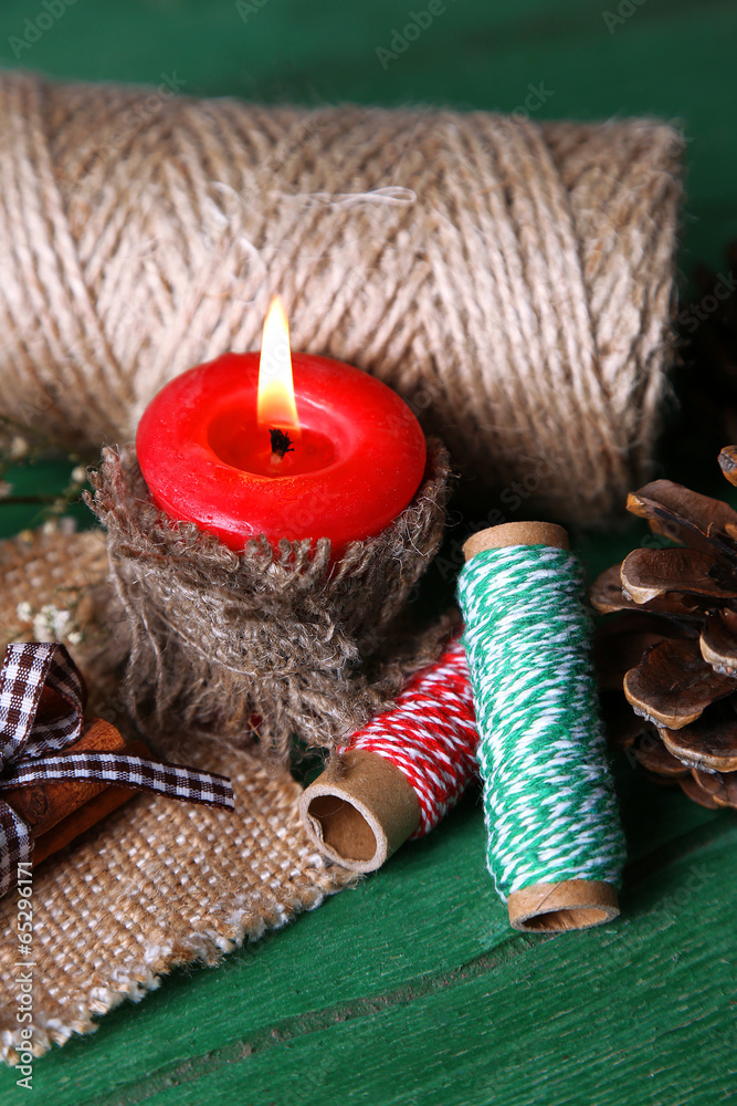 Fototapeta premium Composition with natural bump, candle, thread, cinnamon sticks