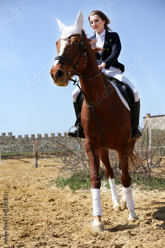 Beautiful girl with horse outdoors