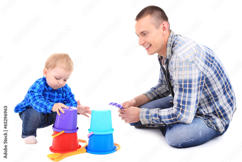Happy young father playing with little son isolated on white Happy young father playing with little son isolated on white