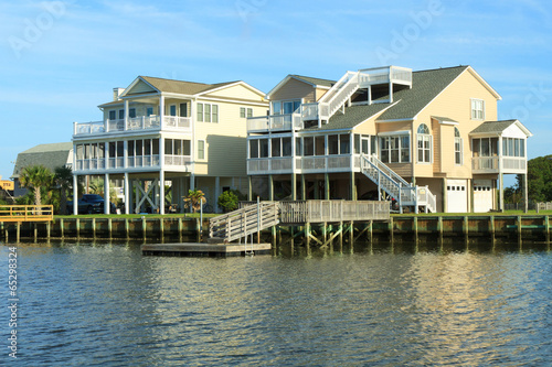 Color DSLR image of luxury vacation beach homes across the intercoastal waterway; horizontal with copy space for text