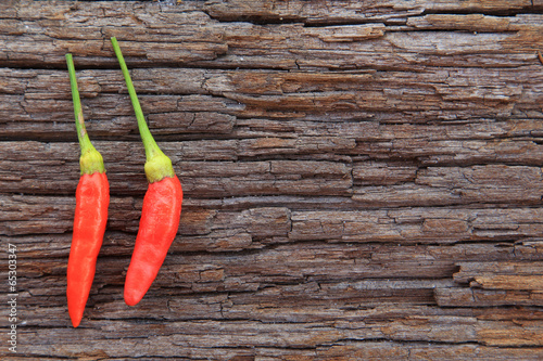 Hot chili peppers on old wooden