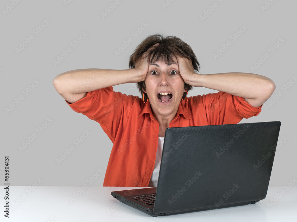 Happy surprised woman on laptop. Or frustration. Happy surprised woman on laptop. Or frustration.