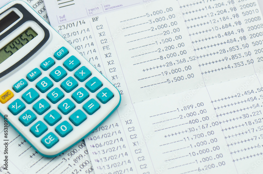 close up bank statement withe calculator close up bank statement withe calculator