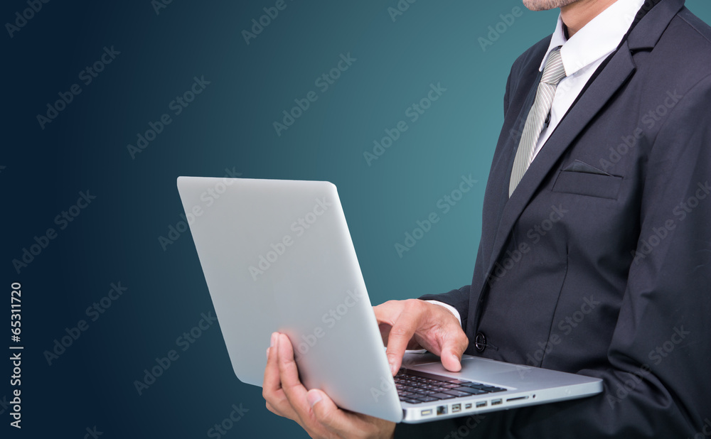 Businessman standing posture hand hold notebook laptop isolated Businessman standing posture hand hold notebook laptop isolated