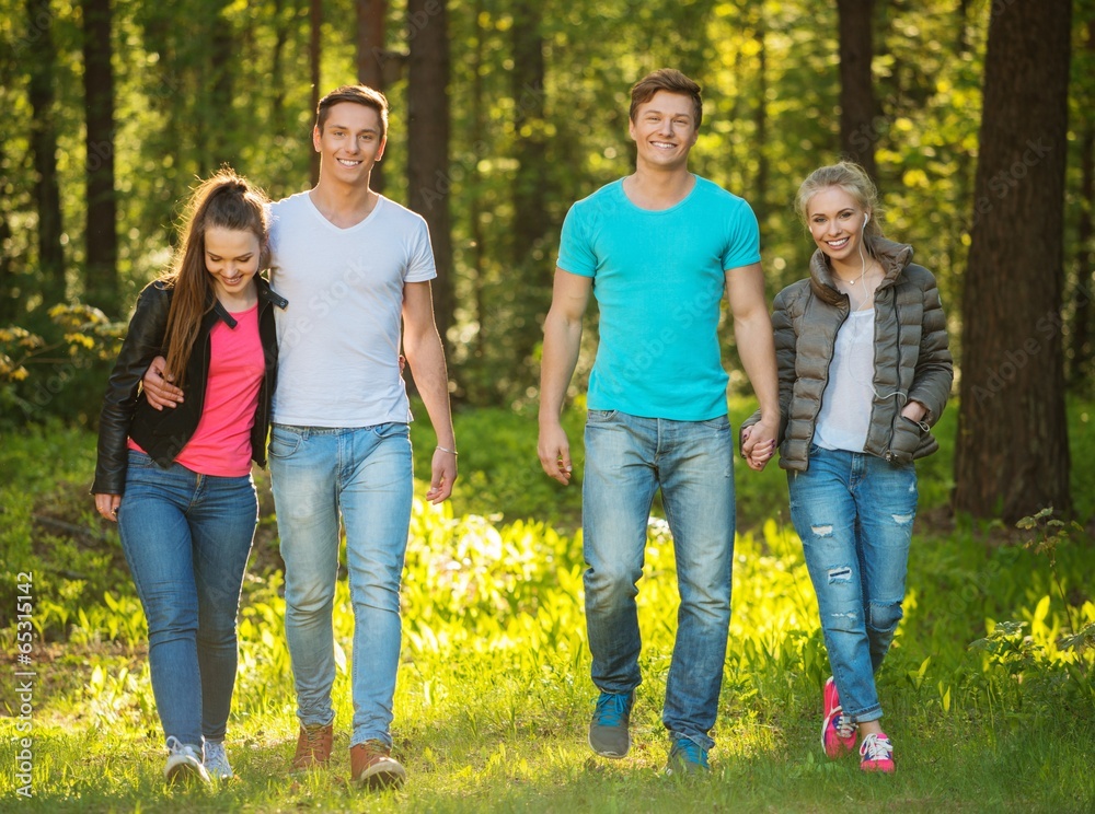 Group of happy friends outdoors on sunny day Group of happy friends outdoors on sunny day
