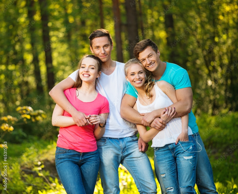 Fototapeta premium Group of happy friends outdoors on sunny day
