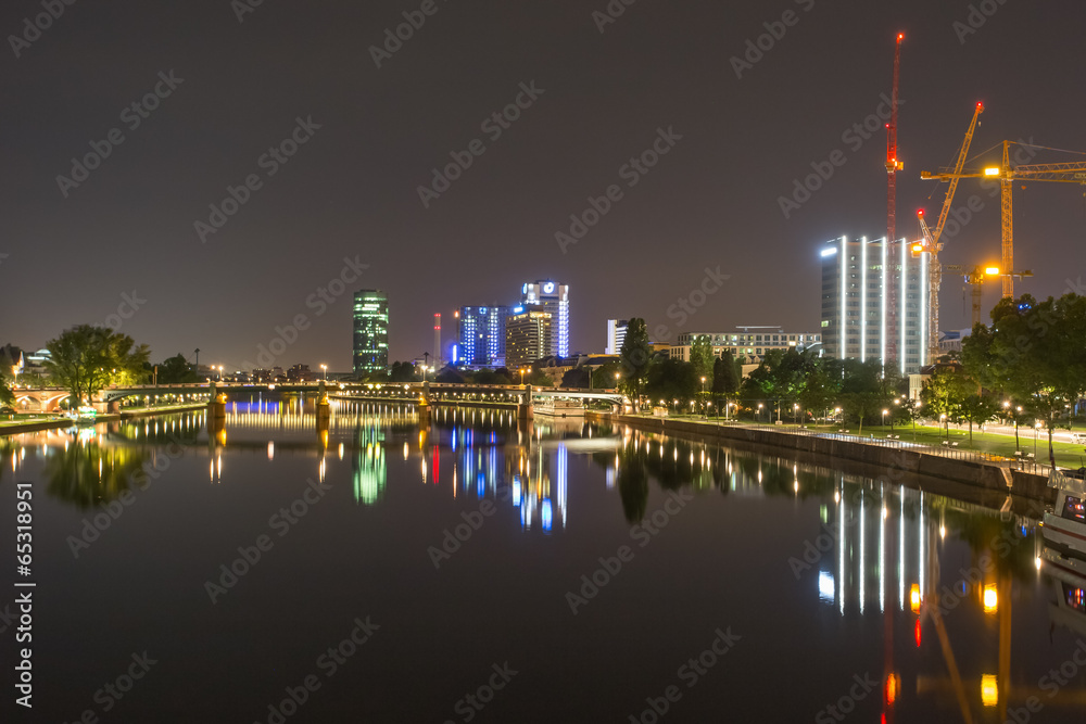 frankfurt city skyline and the main river at night