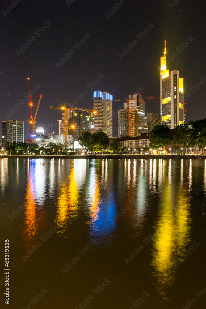 frankfurt city skyline and the main river at night