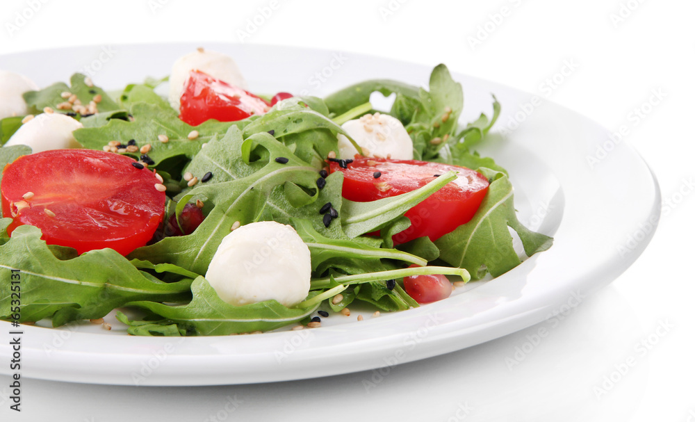 Green salad made with  arugula, tomatoes, cheese mozzarella