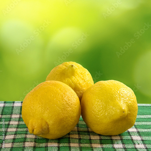 image of lemons on green background