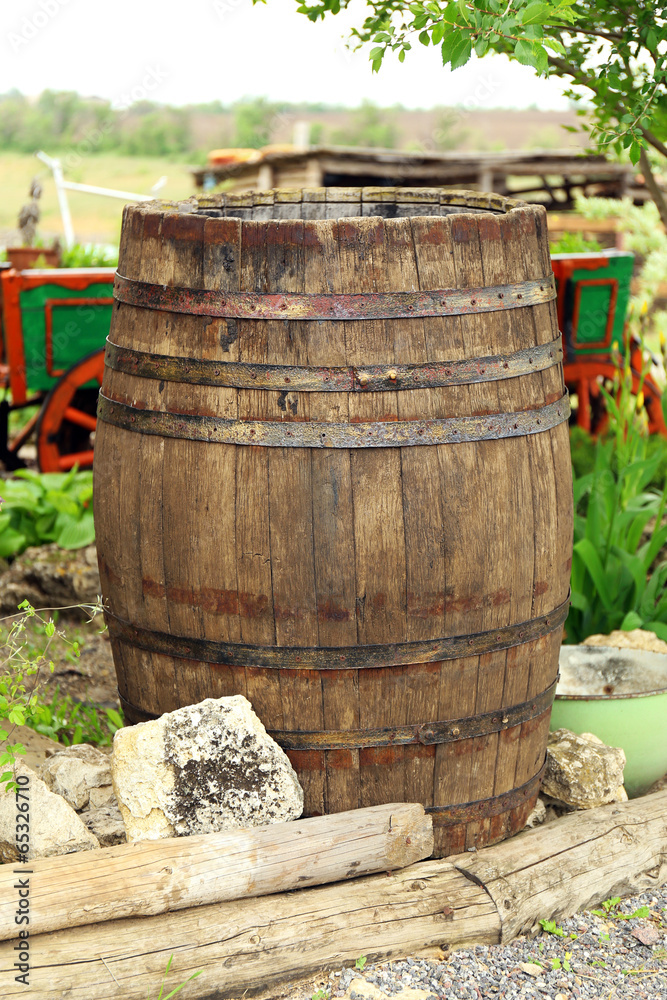 Old wooden barrel, outdoors Old wooden barrel, outdoors