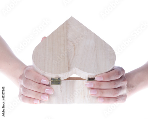 A heart shaped wooden gift box isolated on white