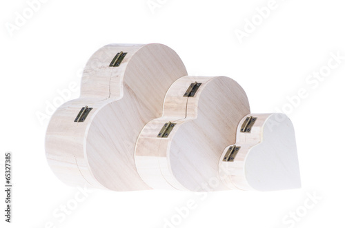 Three heart shaped wooden gift boxes isolated on white