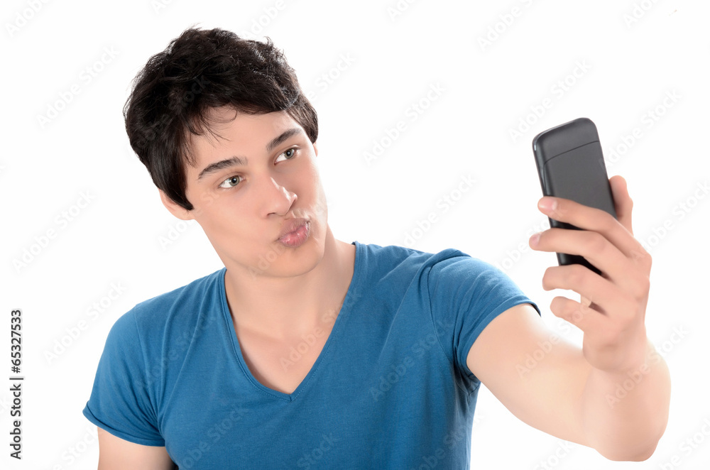 Man taking a kissing selfie photo with his smart mobile phone. Man taking a kissing selfie photo with his smart mobile phone.