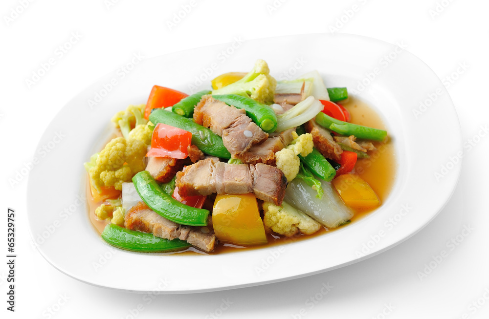 stir fried vegetables in the white plate