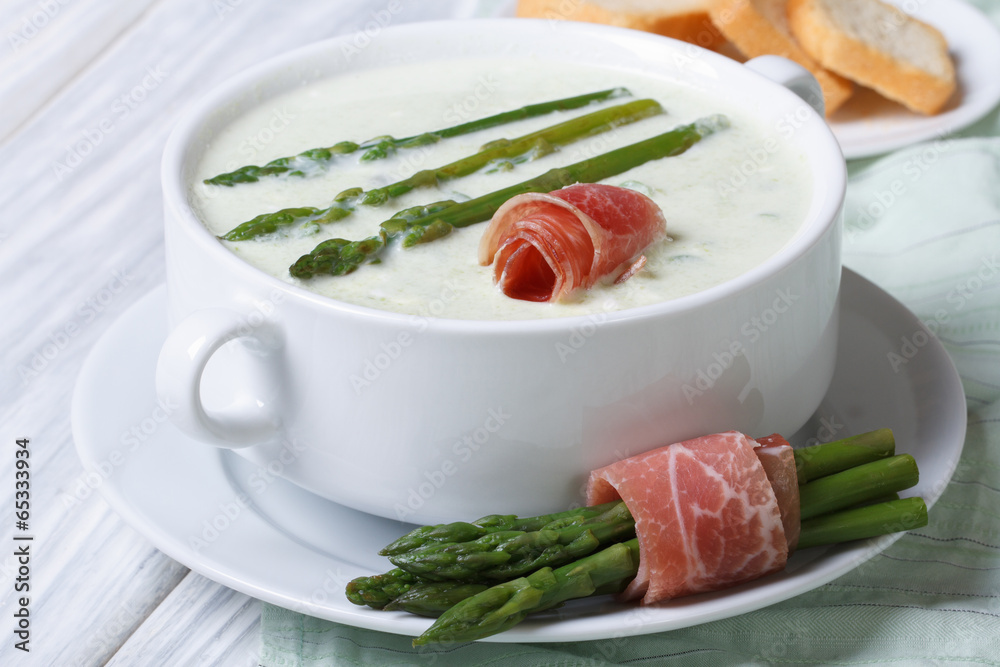 Asparagus cream soup with ham closeup Asparagus cream soup with ham closeup