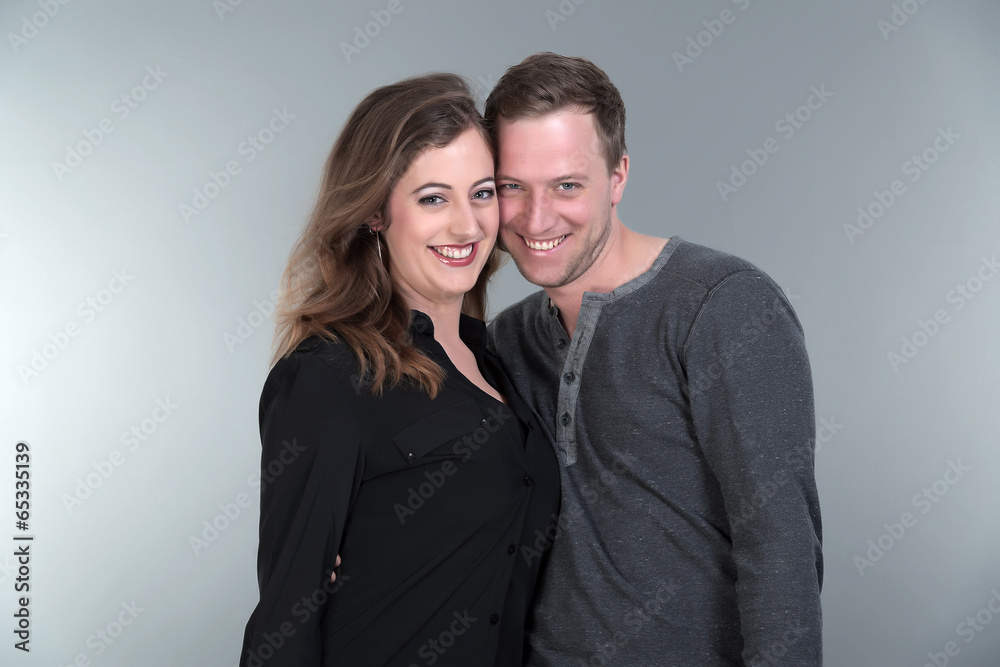 Casual fashion romantic happy couple. Young man and woman. Studi Casual fashion romantic happy couple. Young man and woman. Studi
