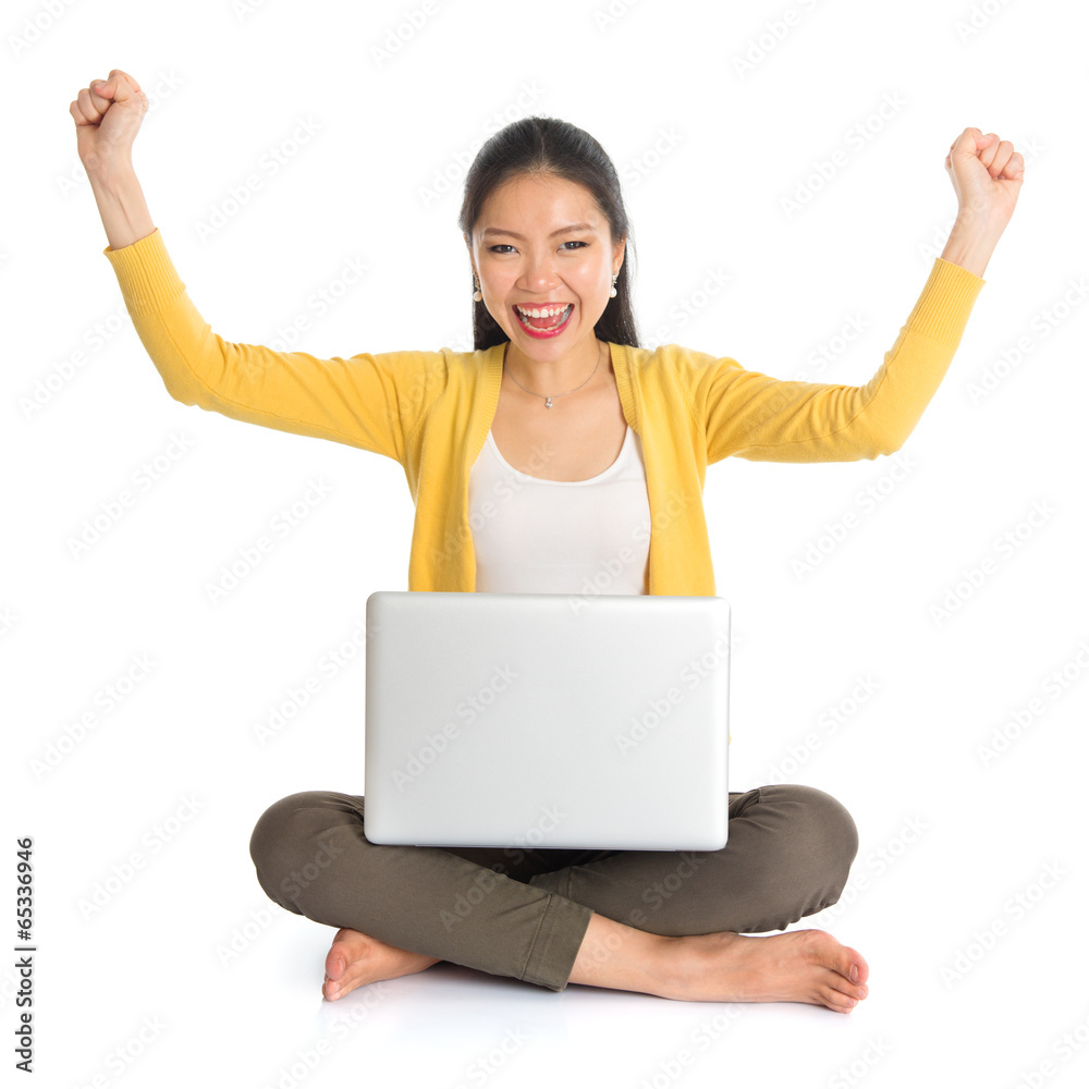Asian girl arms up using laptop computer Asian girl arms up using laptop computer