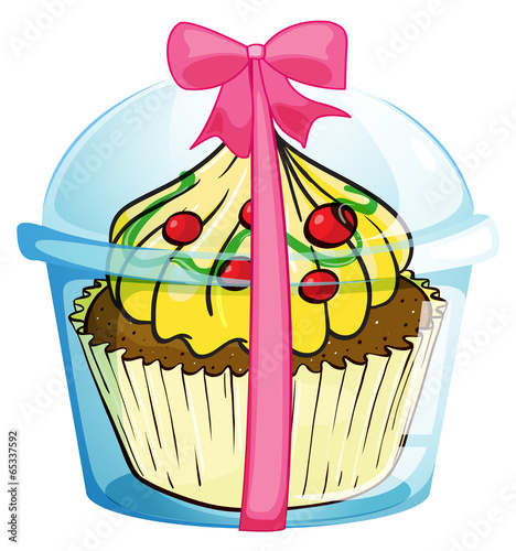 A cupcake with a pink ribbon