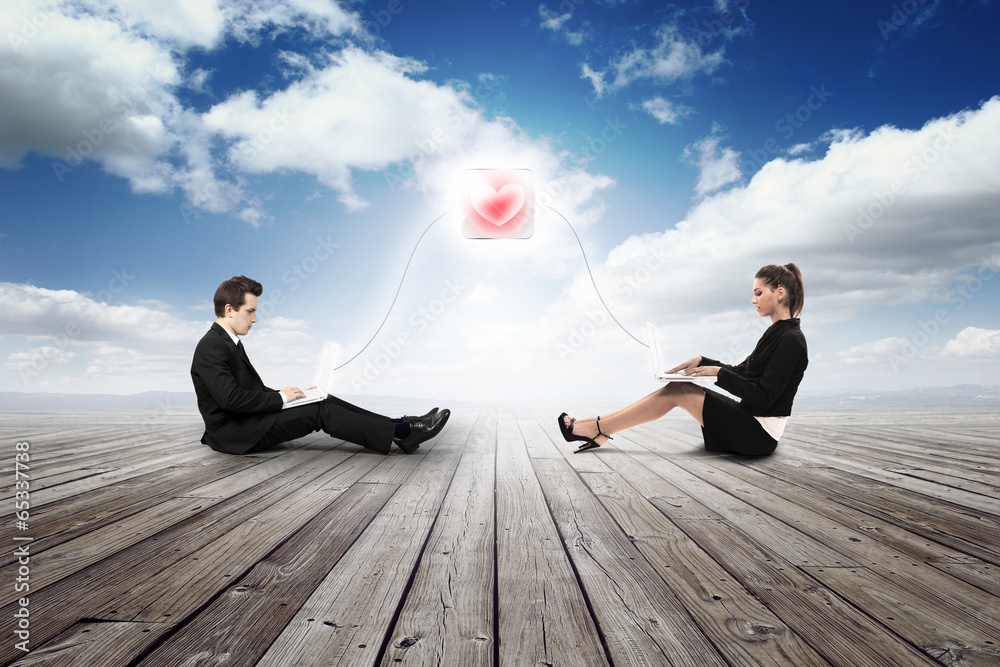 business girl and man are falling in love with laptop business girl and man are falling in love with laptop