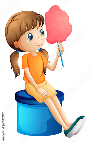 A young woman eating a cotton candy