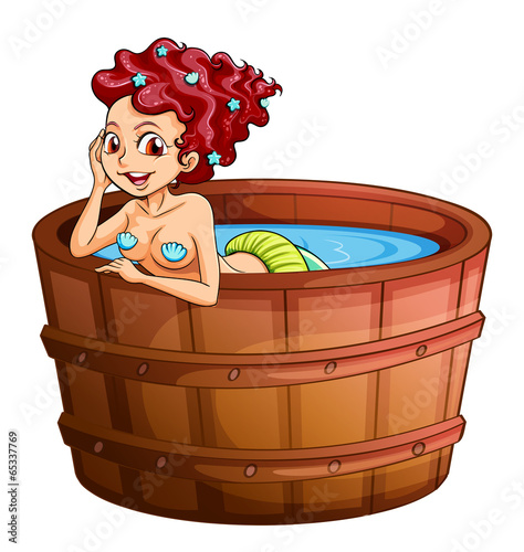 A happy mermaid at the bathtub