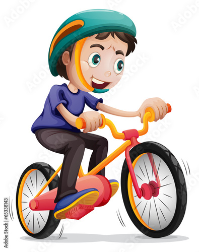 A young boy riding a bicycle