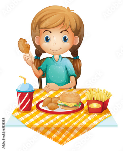 A hungry young girl eating