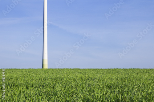 Green field with base of a windturbine