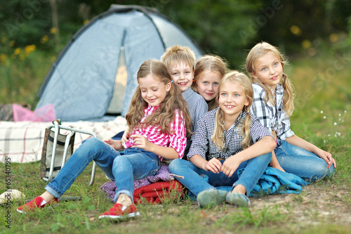 Portrait of young children on a camping holiday