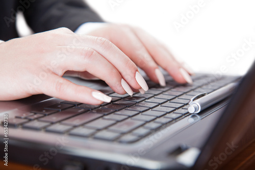 hands using laptop