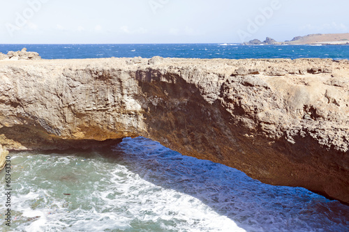 Natural bridge on Aruba island photo