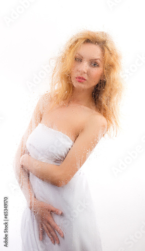Portrait of a girl in white cloth for wet glass