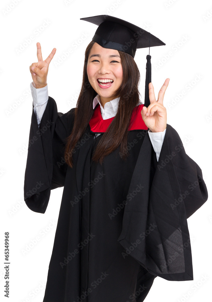 Graduate girl student showing victory sign Graduate girl student showing victory sign