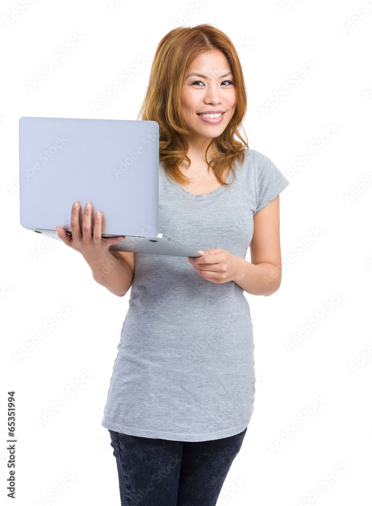 Woman holding laptop computer