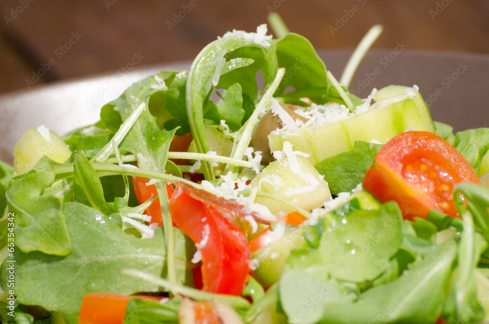 Arugula Salad with tomatoes, olives and parmesan