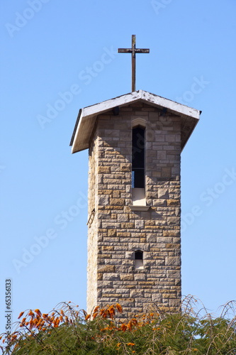 Cross Atop Roof of Bell Tower on Catholic Church